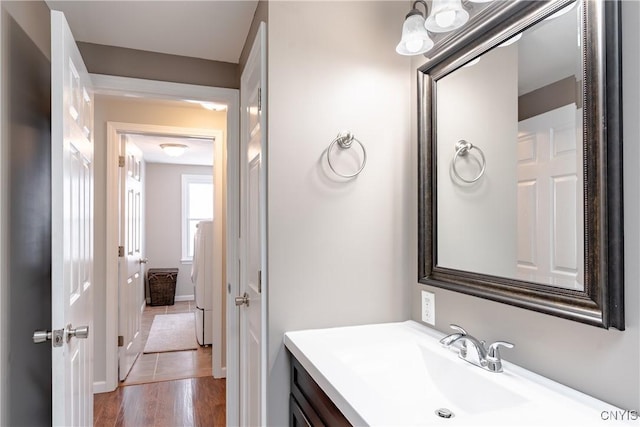 bathroom featuring hardwood / wood-style flooring and vanity