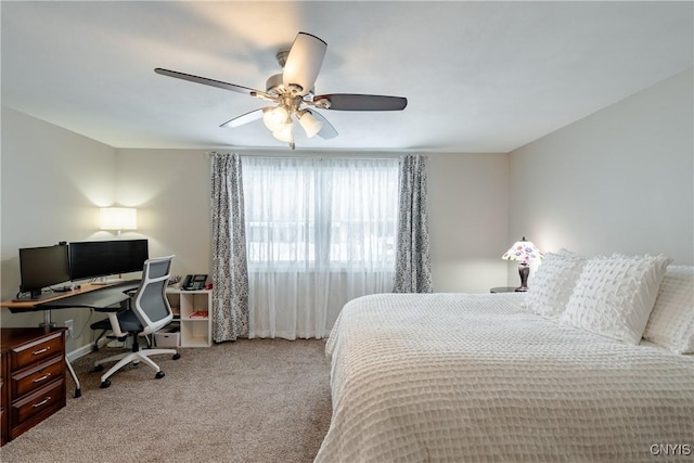 bedroom with ceiling fan and light carpet