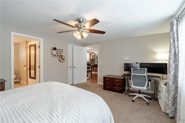 carpeted bedroom with ceiling fan and ensuite bathroom