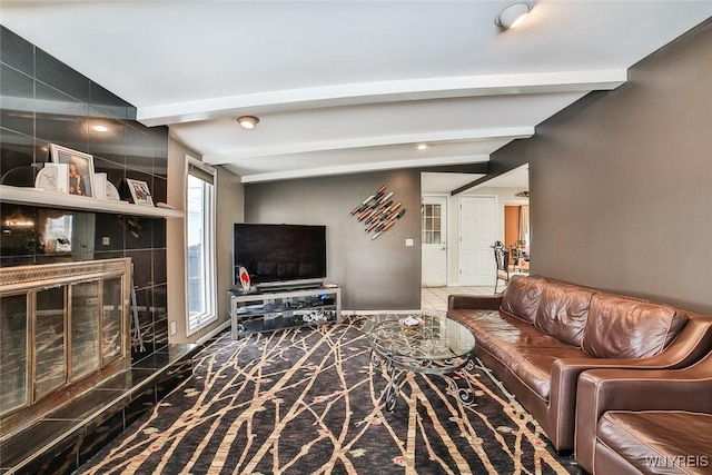 living room featuring beamed ceiling