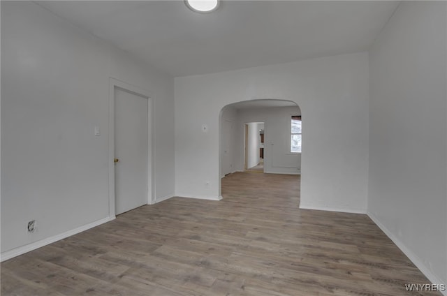 spare room with light hardwood / wood-style flooring