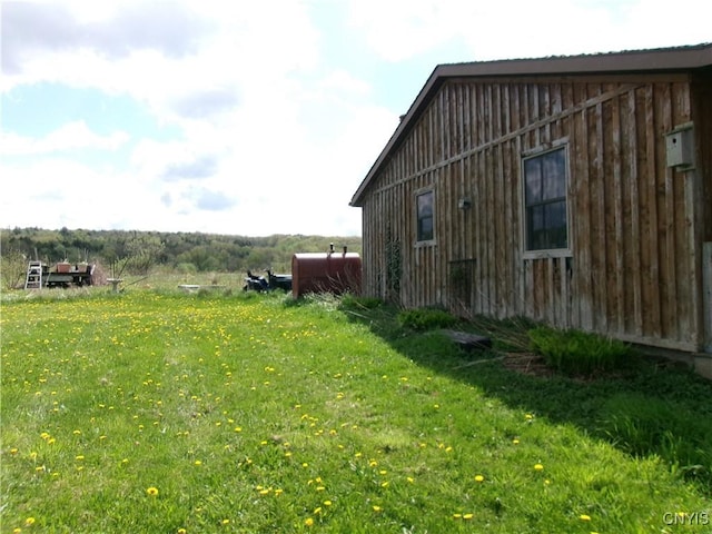 view of home's exterior with a lawn