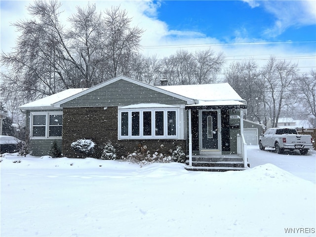 view of front of home featuring a garage and an outdoor structure