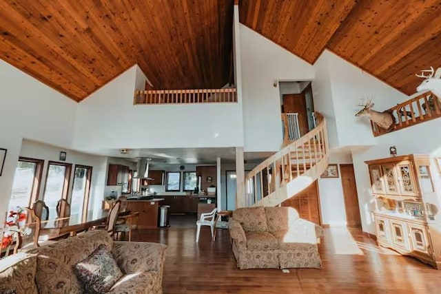 living room with wood-type flooring, high vaulted ceiling, and wooden ceiling