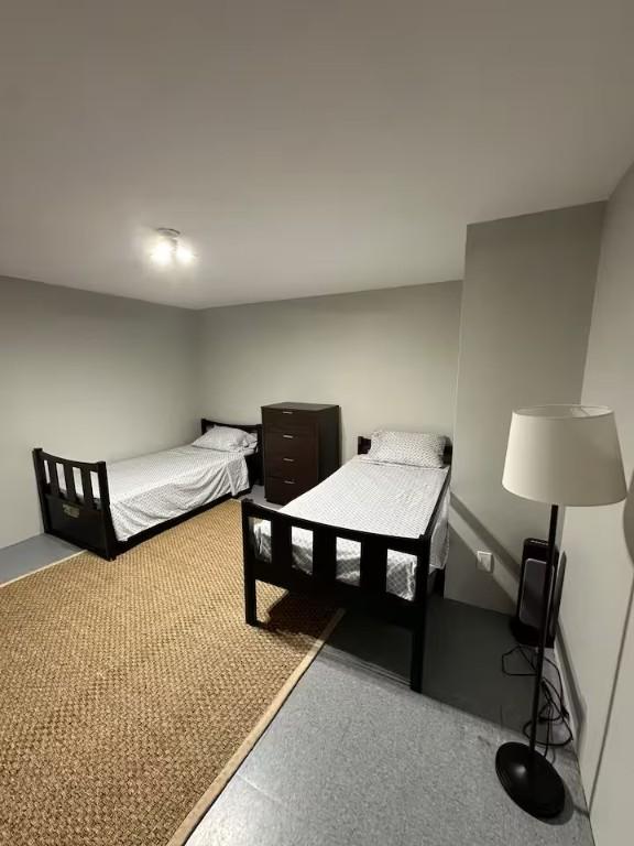 bedroom with light colored carpet