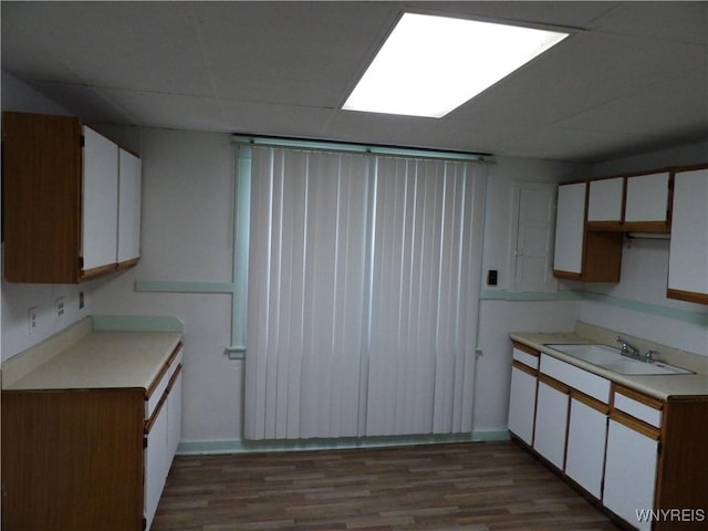 kitchen featuring white cabinetry, light hardwood / wood-style floors, and sink