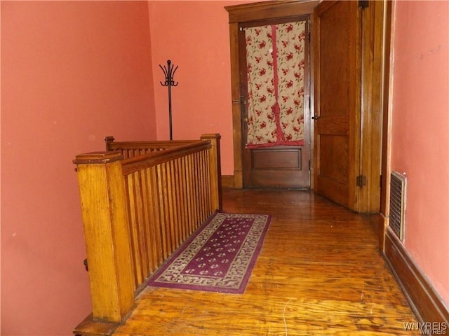 hallway featuring wood-type flooring