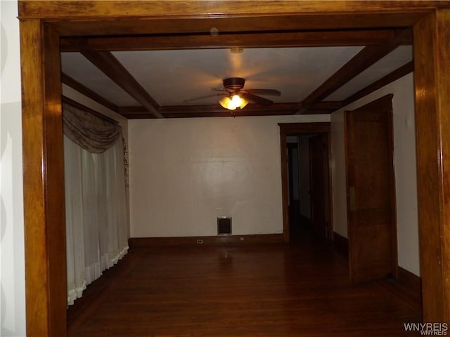 unfurnished room featuring dark hardwood / wood-style floors and ceiling fan