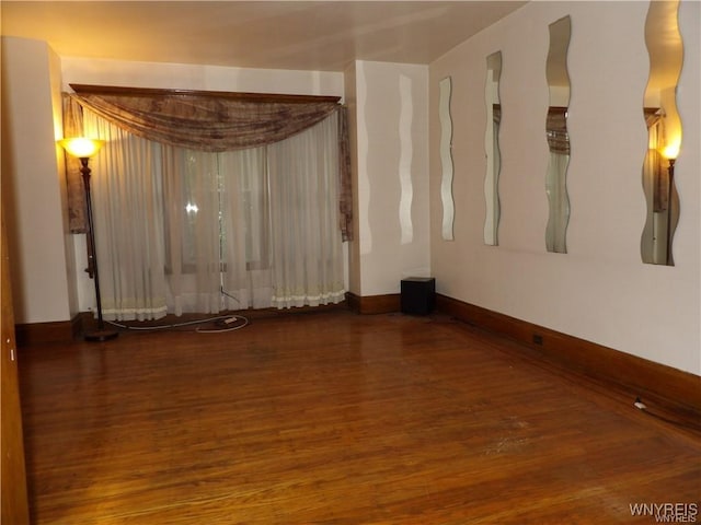 spare room with hardwood / wood-style flooring