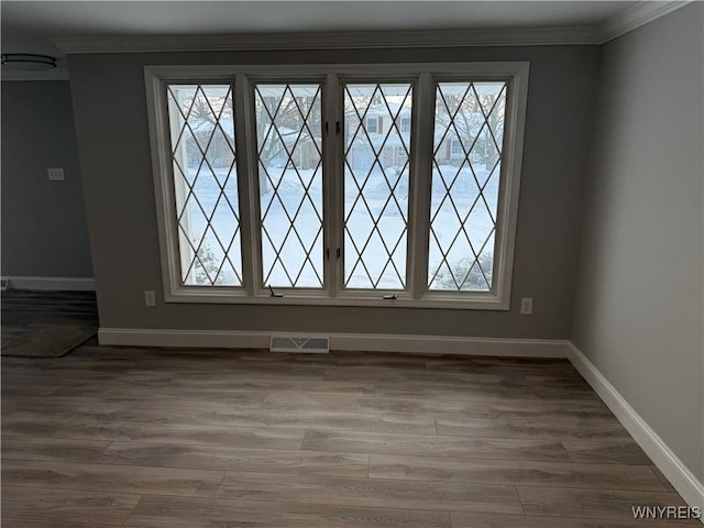 details featuring wood-type flooring and ornamental molding