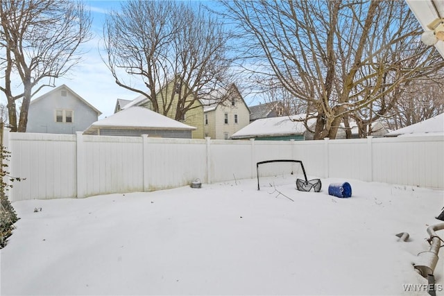 view of yard layered in snow