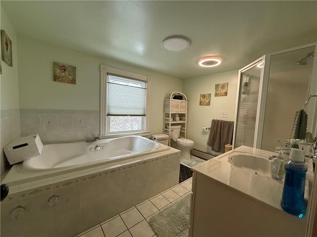 full bathroom featuring baseboard heating, tile patterned flooring, vanity, shower with separate bathtub, and toilet