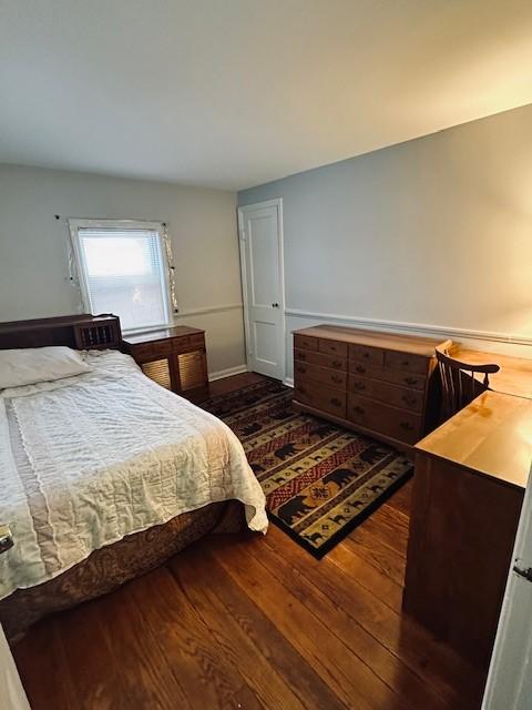 bedroom featuring dark wood-type flooring