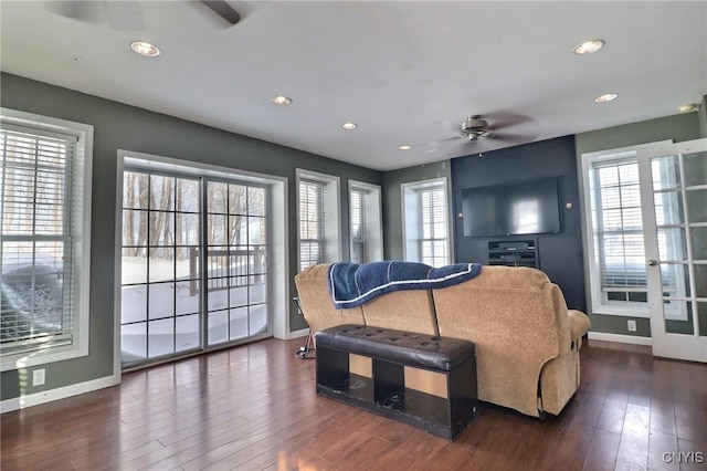 interior space with ceiling fan and dark hardwood / wood-style floors