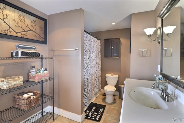 bathroom with a notable chandelier, vanity, toilet, and tile patterned floors