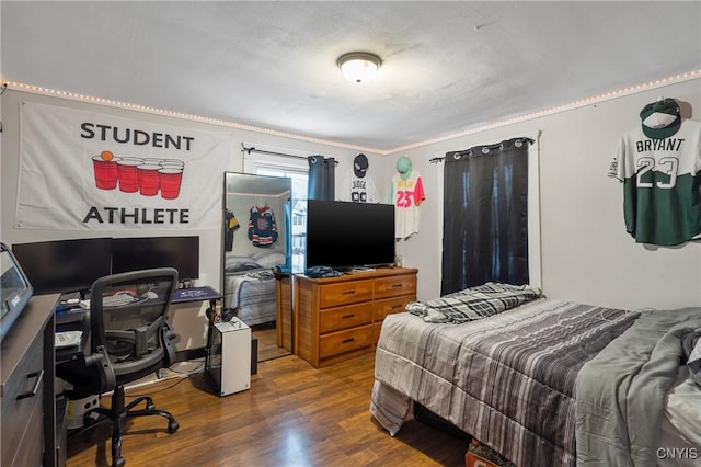 bedroom featuring dark wood-type flooring