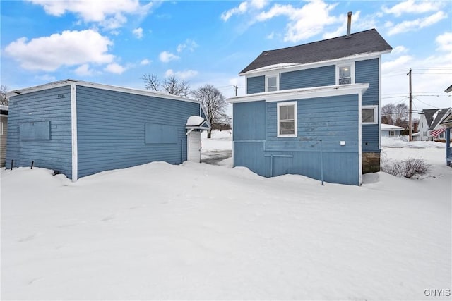 view of snow covered house