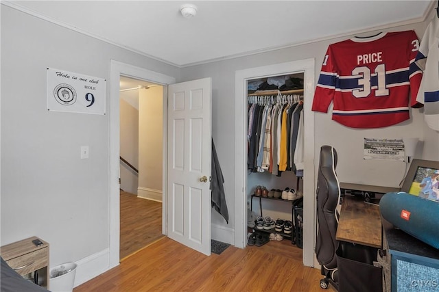 bedroom with a closet and hardwood / wood-style flooring