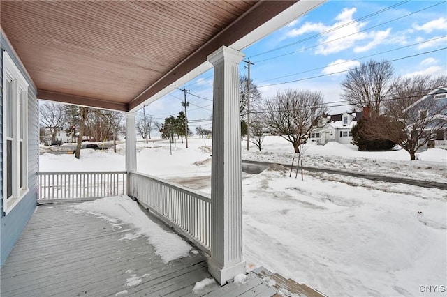 view of snow covered deck