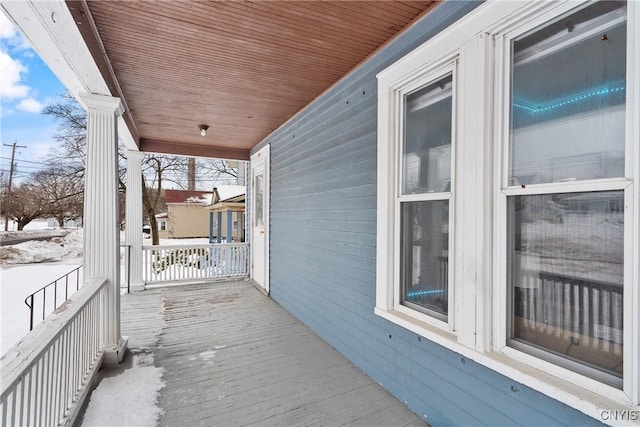 view of snow covered deck