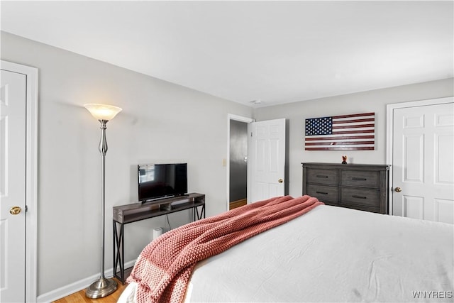 bedroom with wood-type flooring