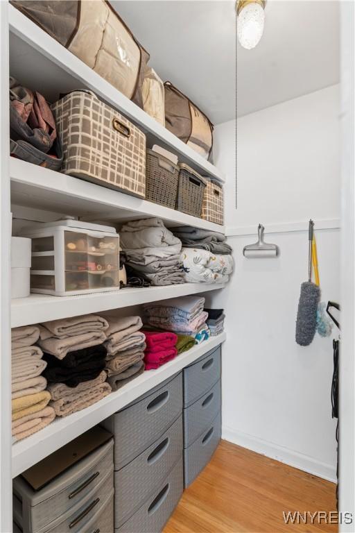 spacious closet featuring light wood-type flooring