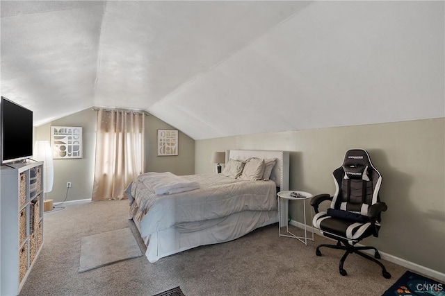 carpeted bedroom with vaulted ceiling