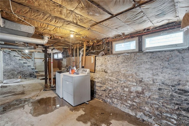 basement featuring washing machine and clothes dryer