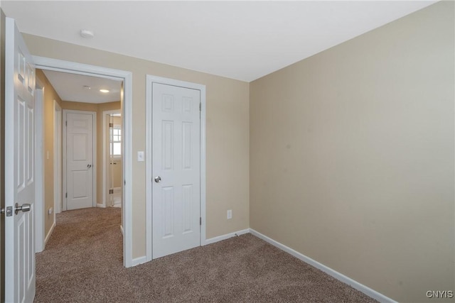 unfurnished bedroom with carpet