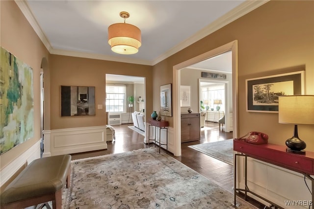 foyer with dark hardwood / wood-style flooring and ornamental molding