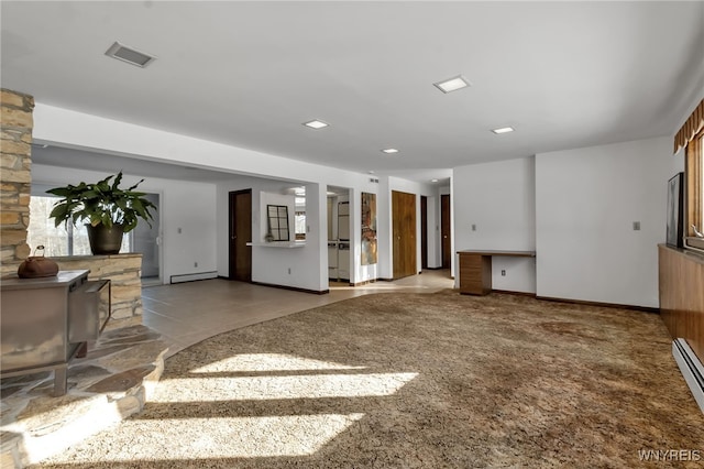 unfurnished living room with a baseboard radiator