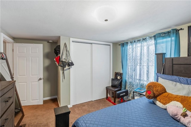 carpeted bedroom featuring a closet