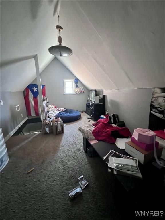 bonus room featuring carpet floors and lofted ceiling