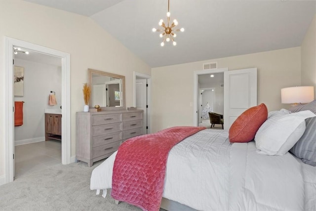 carpeted bedroom featuring connected bathroom, vaulted ceiling, and an inviting chandelier