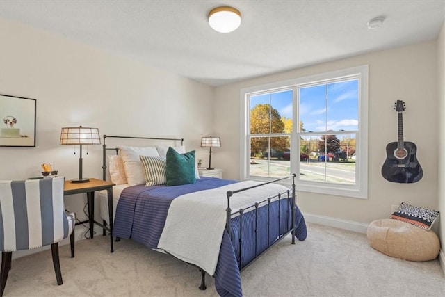 bedroom featuring light carpet