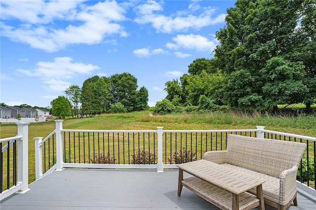 wooden deck featuring a yard