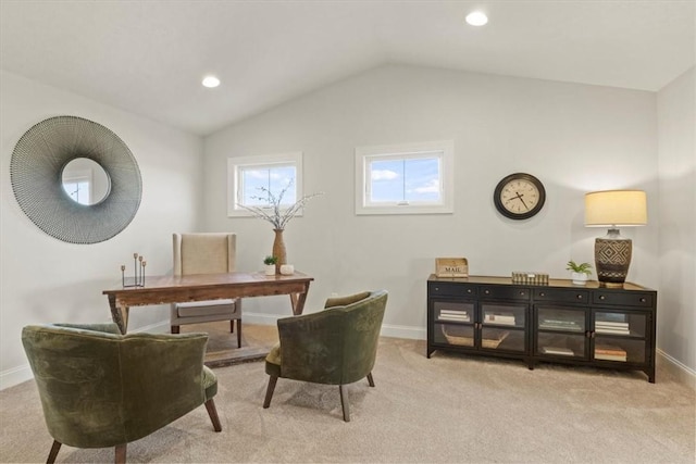 carpeted home office with lofted ceiling