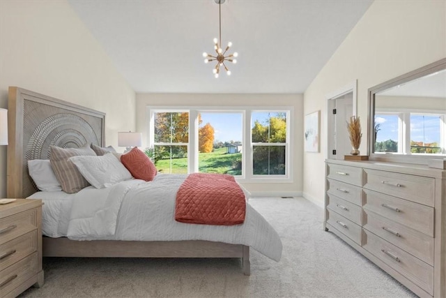 bedroom with light carpet, vaulted ceiling, and an inviting chandelier