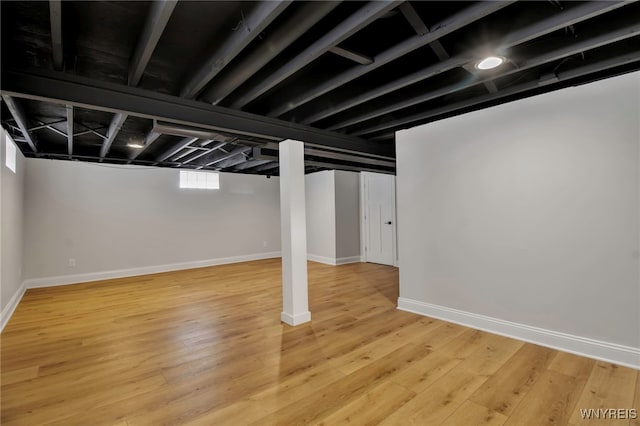 basement featuring hardwood / wood-style flooring