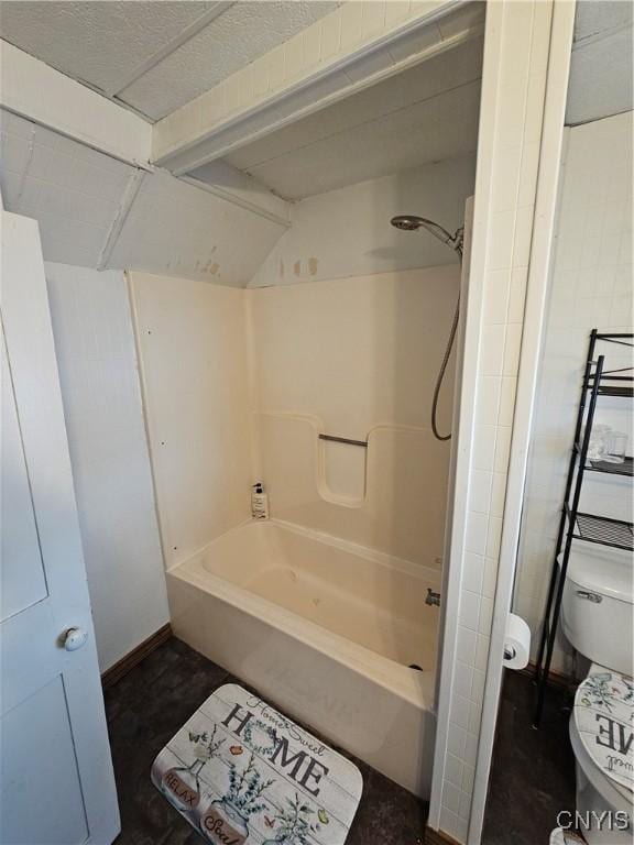 bathroom featuring toilet and shower / bathing tub combination