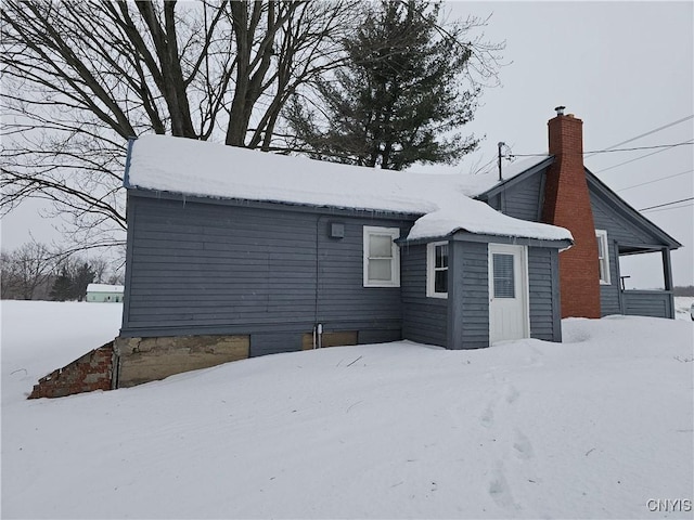 view of snow covered house