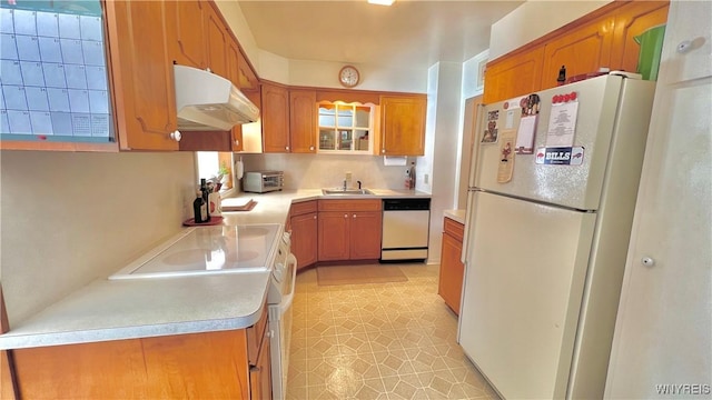 kitchen featuring sink and white appliances