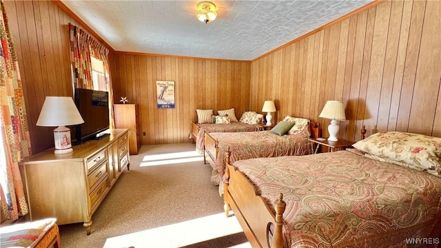 bedroom with light carpet, wood walls, and ornamental molding