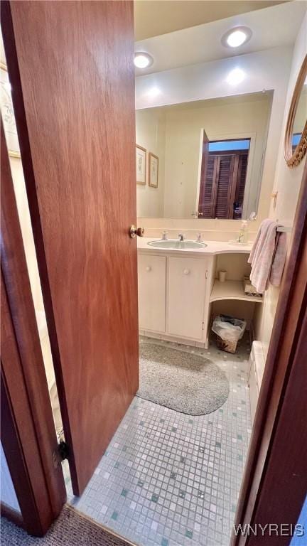 bathroom with vanity and tile patterned flooring