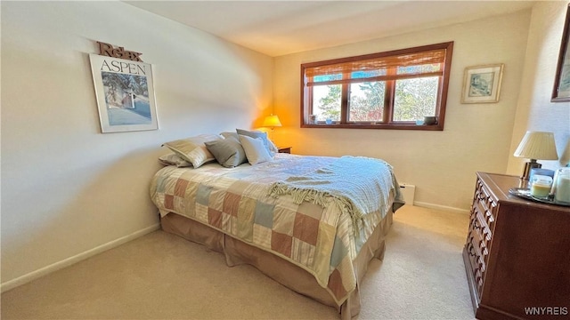 bedroom with light colored carpet