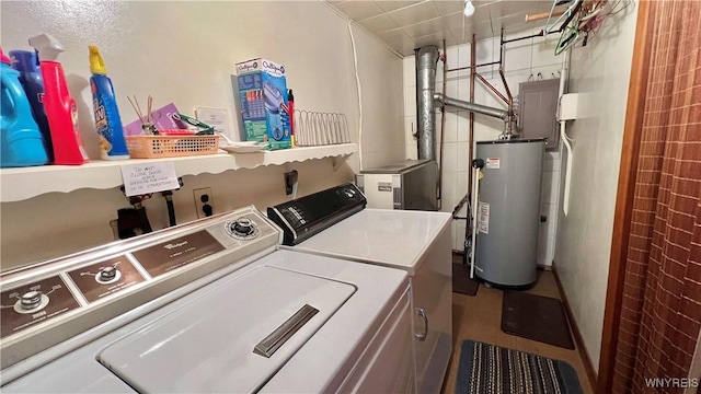 laundry area with washing machine and clothes dryer and gas water heater