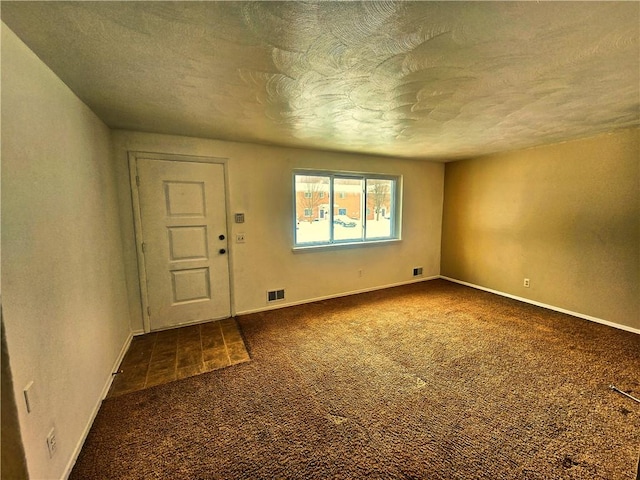 interior space featuring a textured ceiling