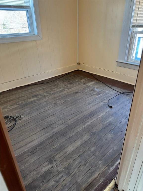 spare room with dark wood-type flooring