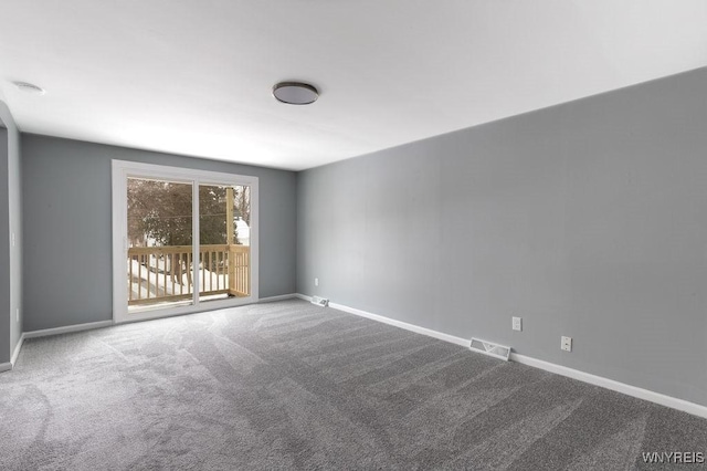 unfurnished room featuring carpet