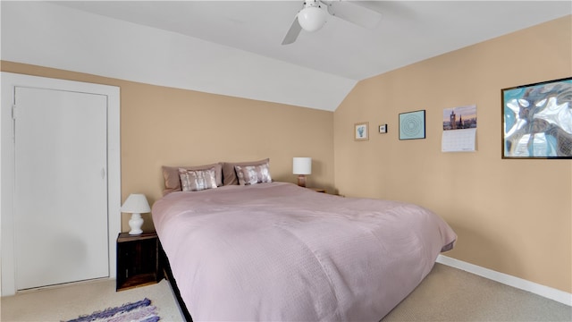 carpeted bedroom featuring lofted ceiling and ceiling fan